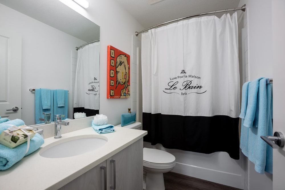 Bathroom with vanity and tub