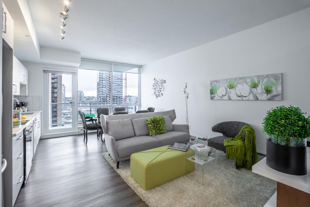 Living room and kitchen with downtown views